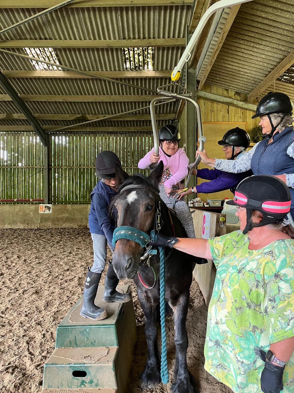Volunteers and riders working together in a session at Lelant Downs