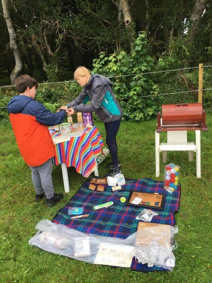 Volunteers and riders in the arena